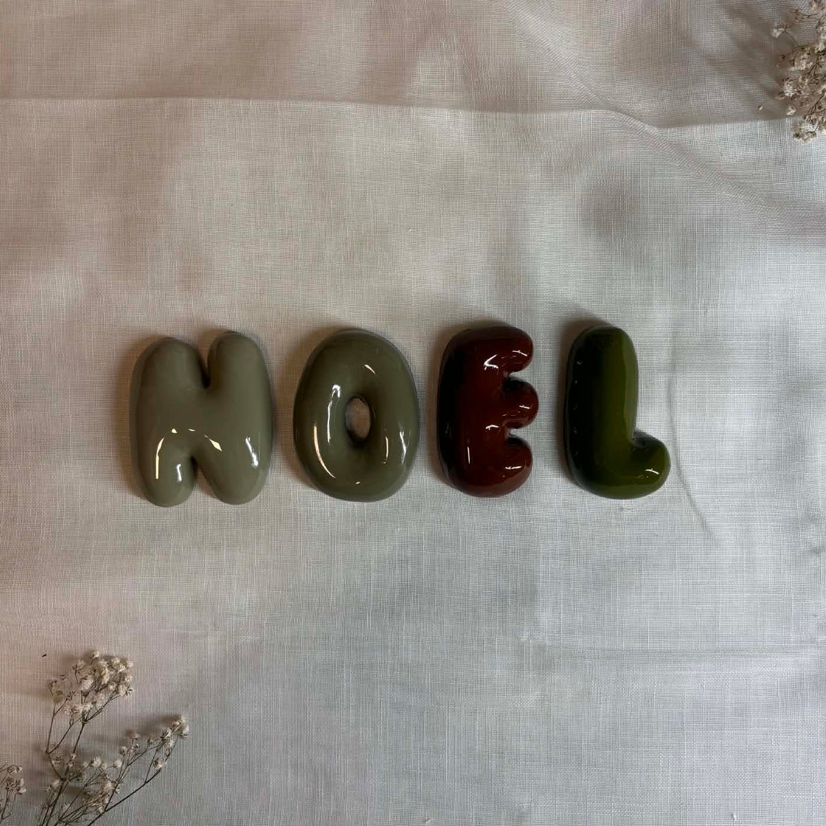 Letters forming the name Noel
